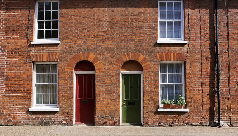 Listed brick retail unit refurbished, original frontage and archways retained